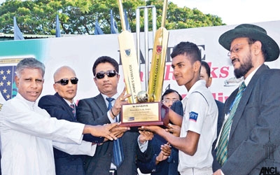 Rev. Bro. Ernest Tarcisius presenting the trophy